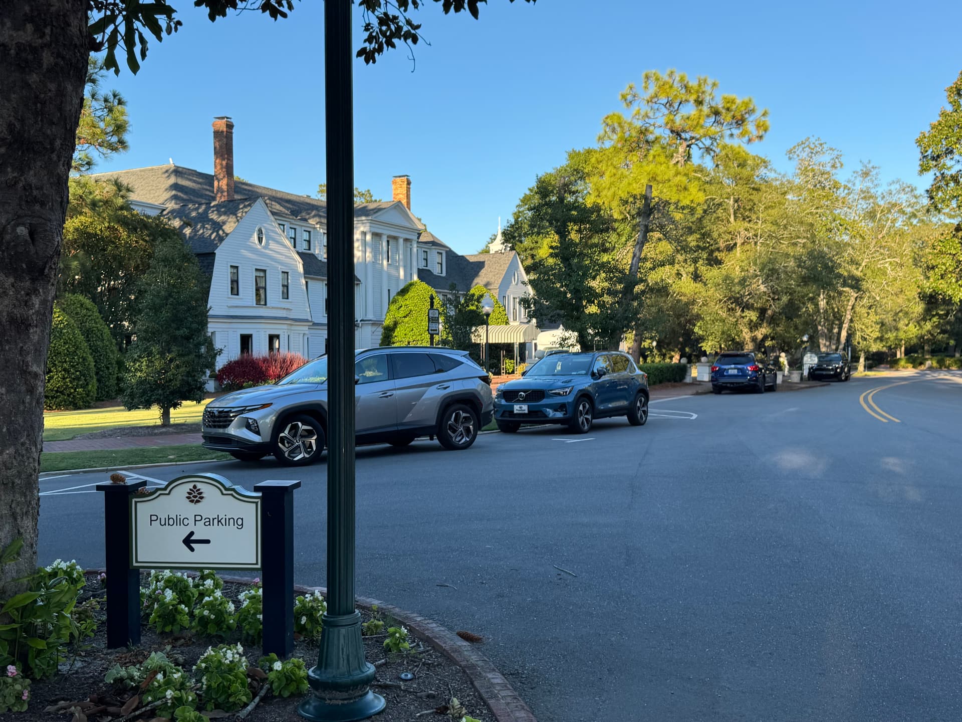 Tree-lined village street with historic white homes in Pinehurst