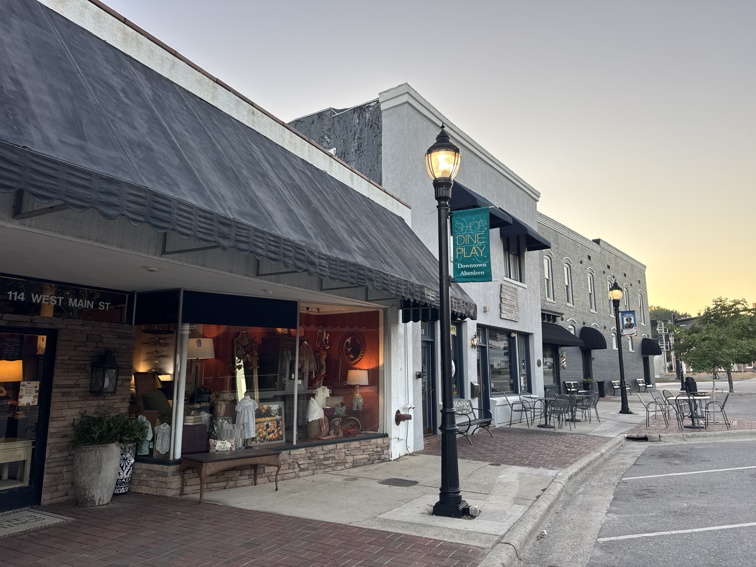 White storefront row with striped awnings in downtown Aberdeen