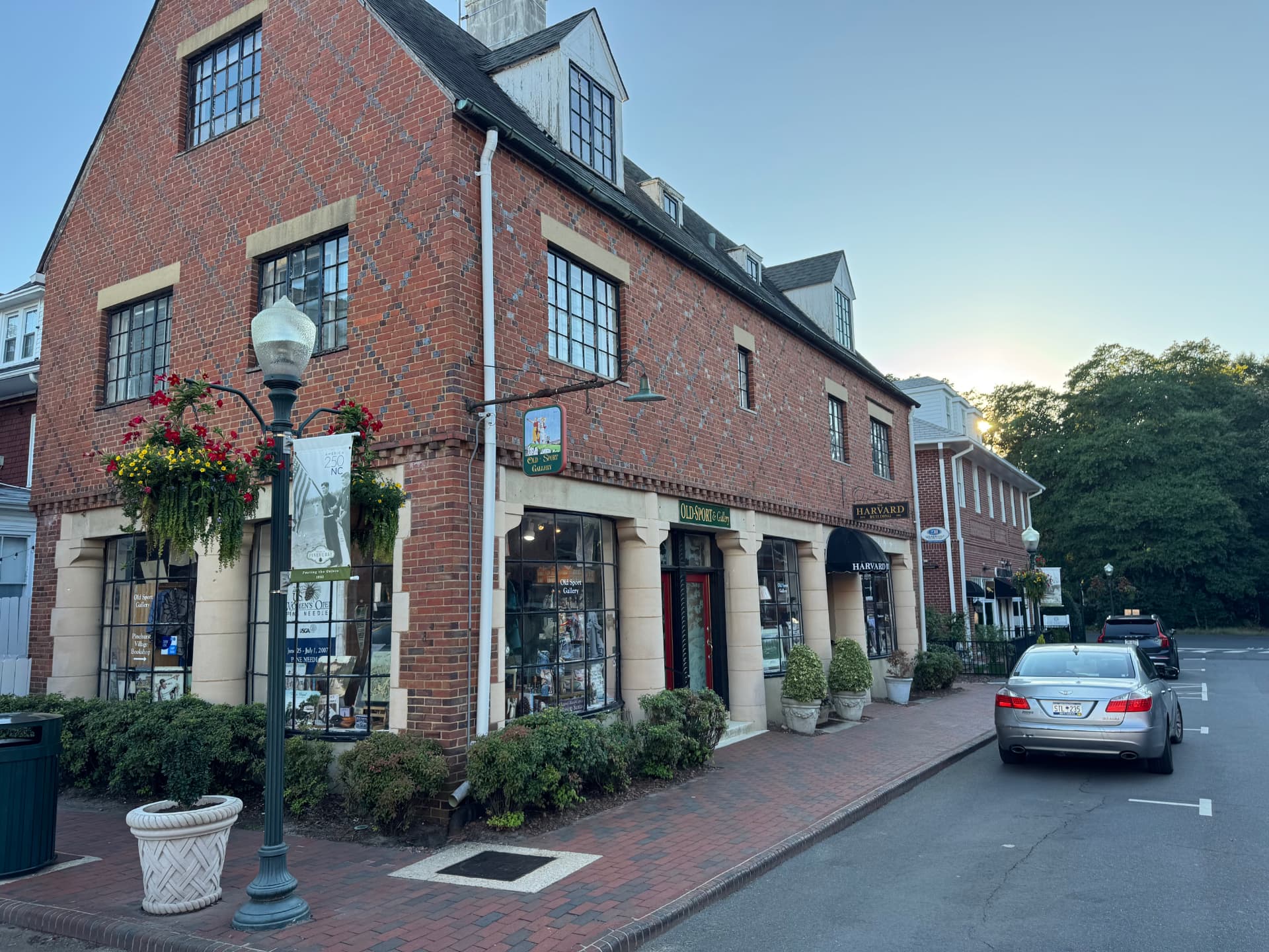 Historic brick storefronts in the Village of Pinehurst at sunset