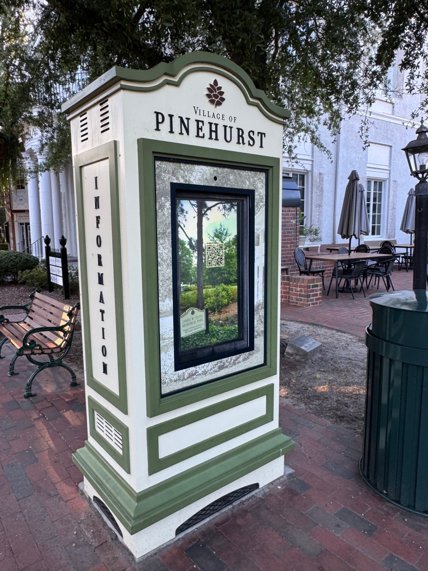 Village of Pinehurst information kiosk beneath the trees