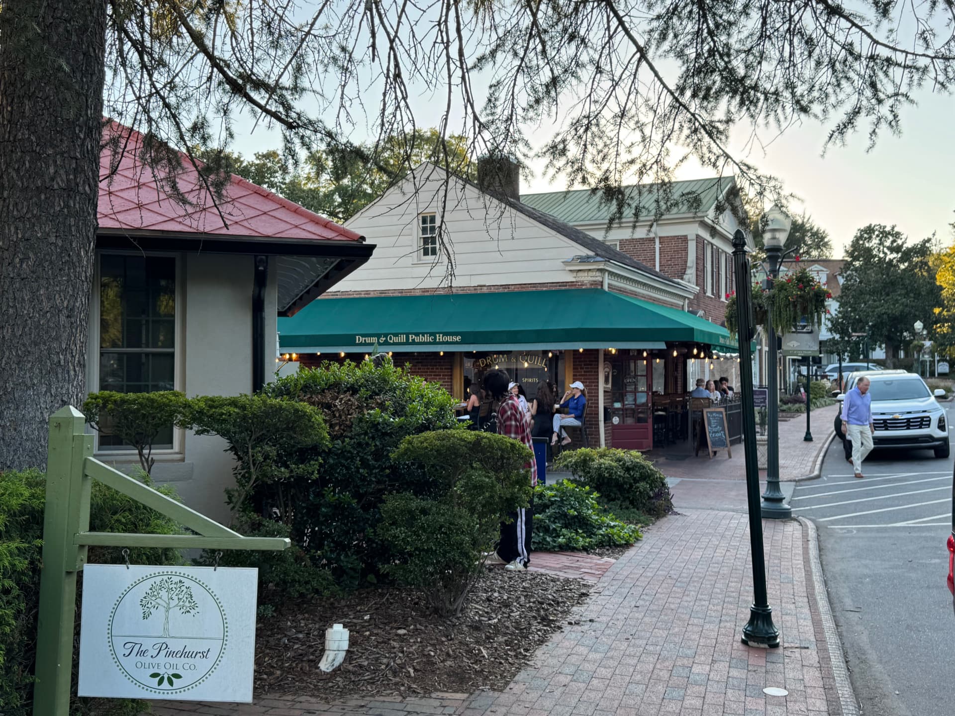 Evening crowd outside the Drum & Quill Public House in the Village of Pinehurst