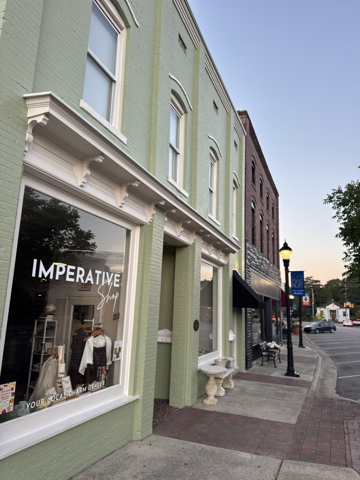 Imperato boutique windows on a downtown Aberdeen sidewalk
